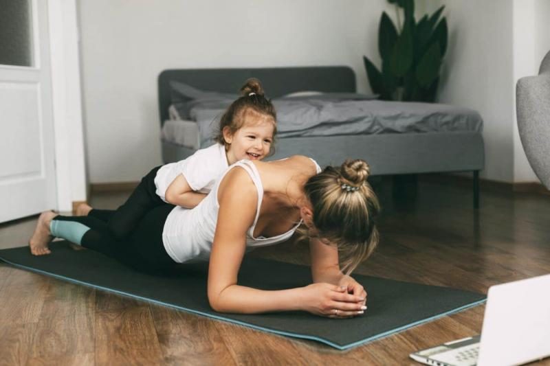 a-young-sports-mom-and-a-girl-together-do-exercises-at-home-healthy-development-of-parents-and_t20_ypn3w0-1440x960-8984635